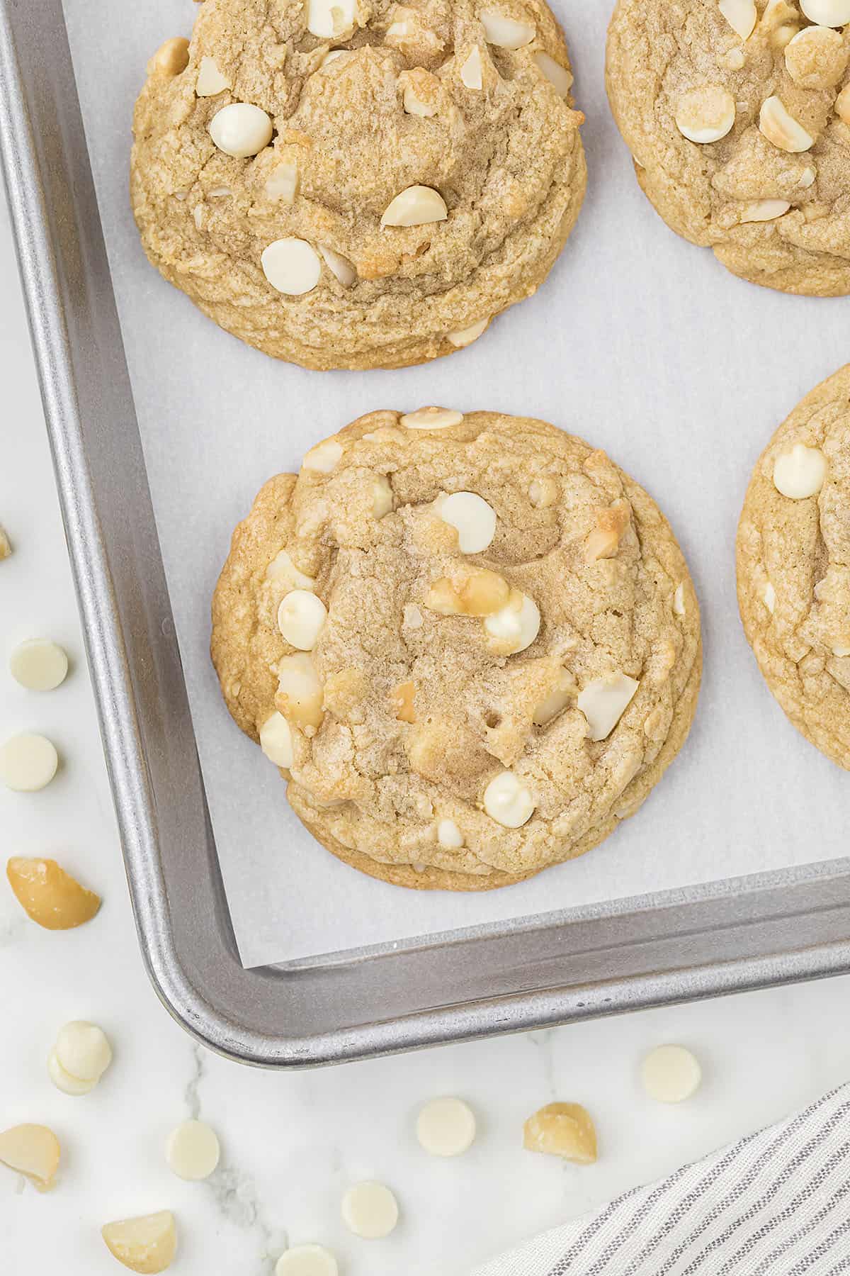 Macadamia nut cookies on baking sheet.