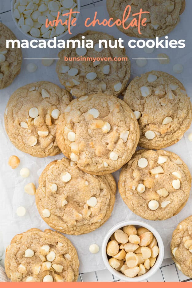 White chocolate cookies piled on counter.