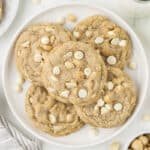 Plate full of white chocolate macadamia nut cookies.