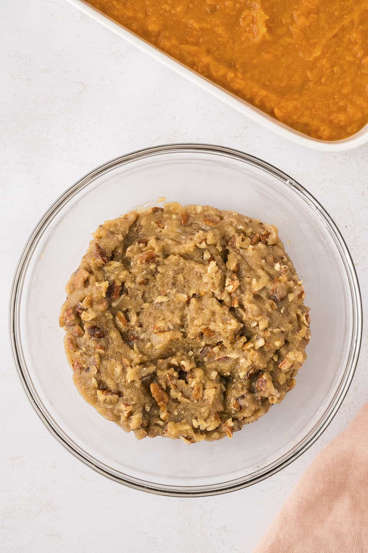 Topping for sweet potato casserole in glass mixing bowl.