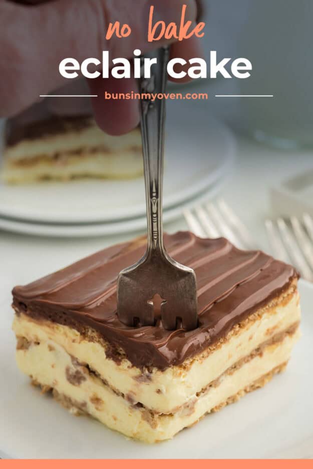 Fork stuck in a piece of eclair cake.