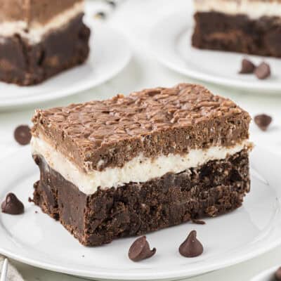 Marshmallow brownies on white plates.