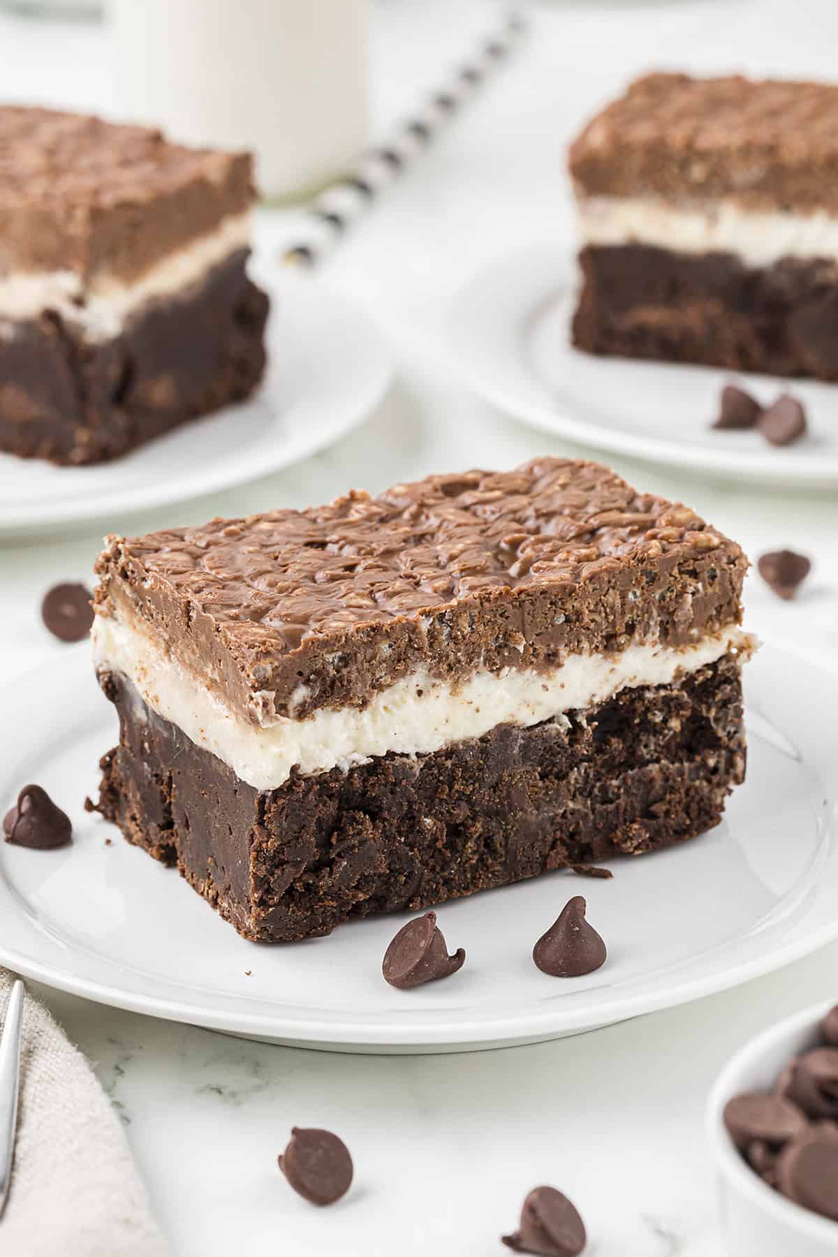 Marshmallow brownies on white plates.