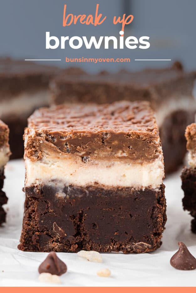 Brownie topped with marshmallow frosting and chocolate cereal.