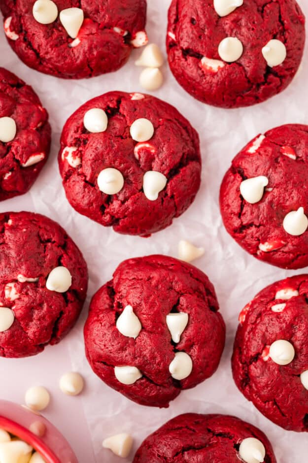 Baked red velvet cake cookies topped with white chocolate chips.