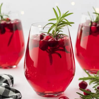 Christmas sangria in stemless wine glasses.