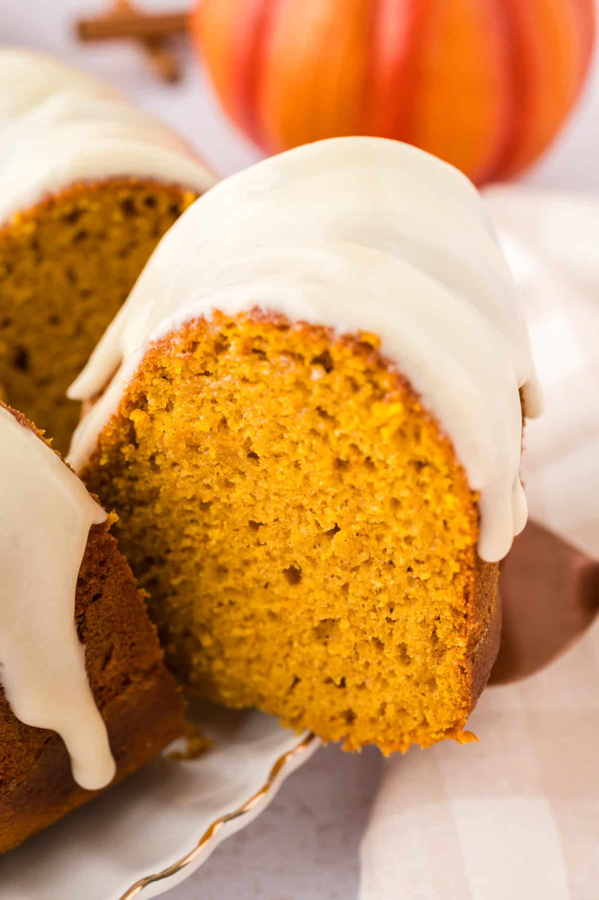 Slice of pumpkin cake on cake server.