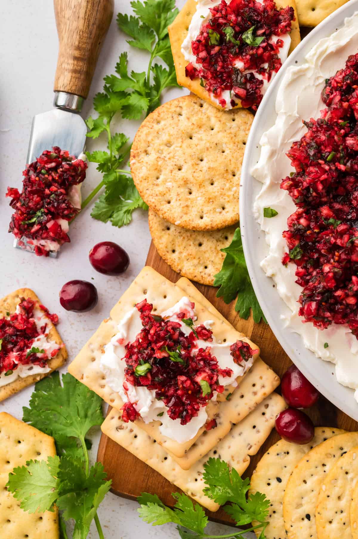 Cranberry cream cheese dip on a cracker.