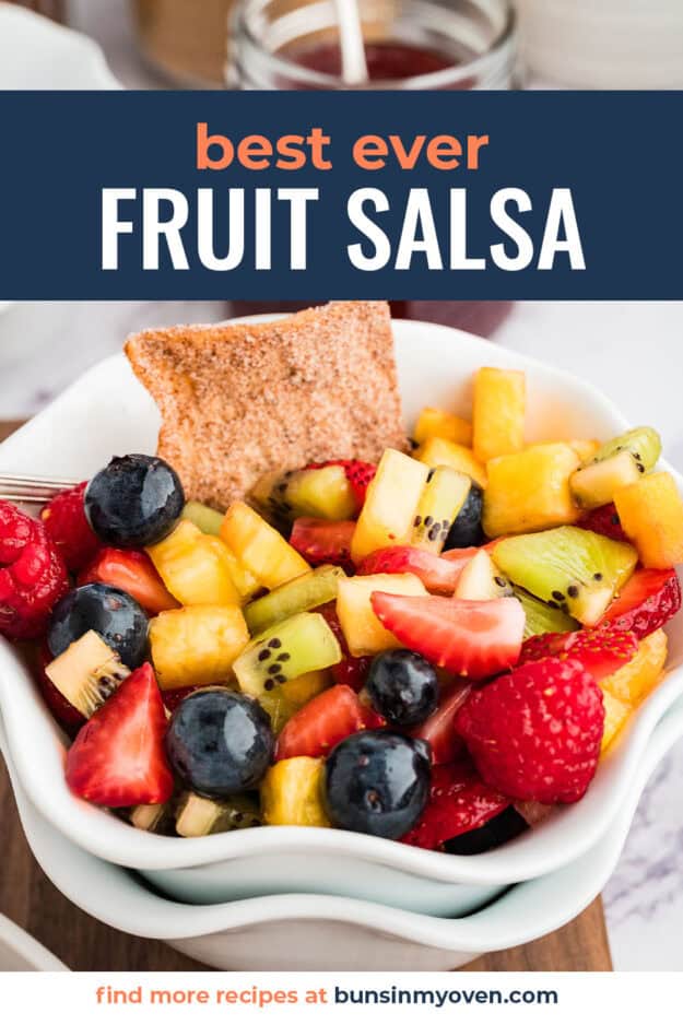 Fruit salsa in bowl with pita chip.