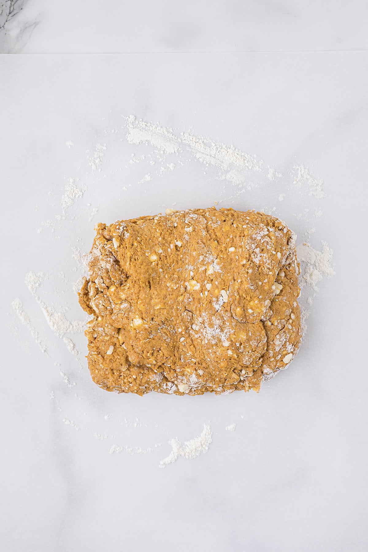 Pumpkin scone dough on counter.