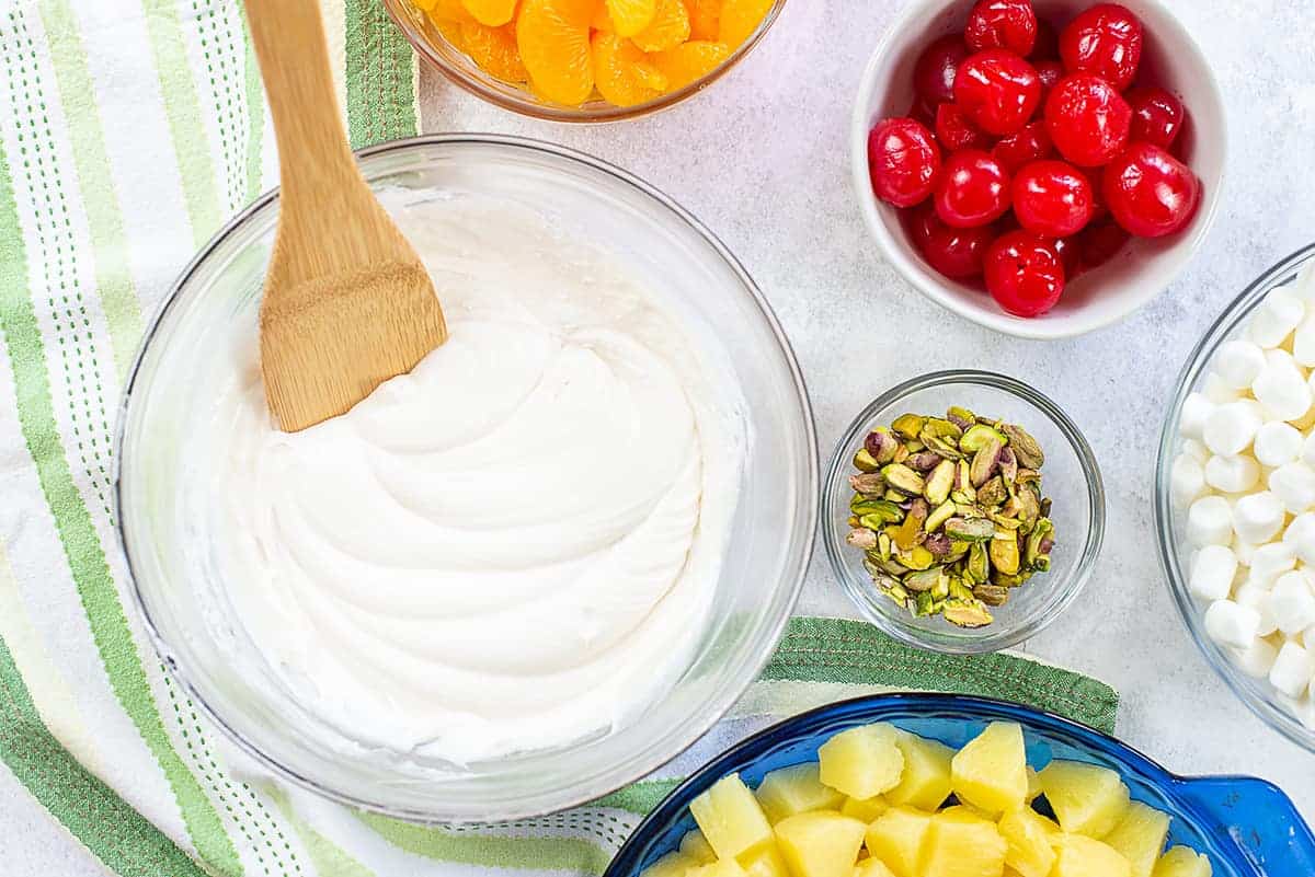 ingredients for ambrosia salad on white counter