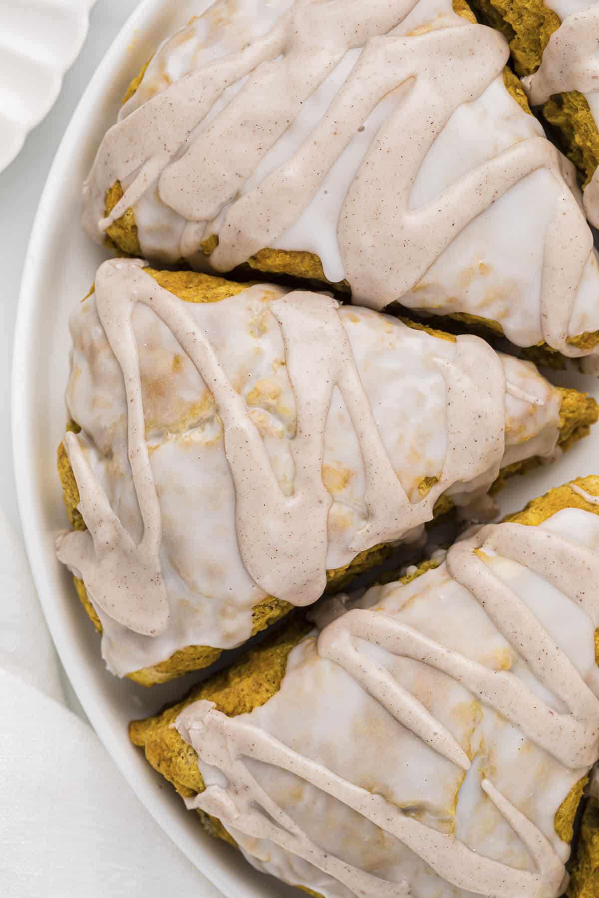 Starbucks pumpkin scone recipe on white plate.