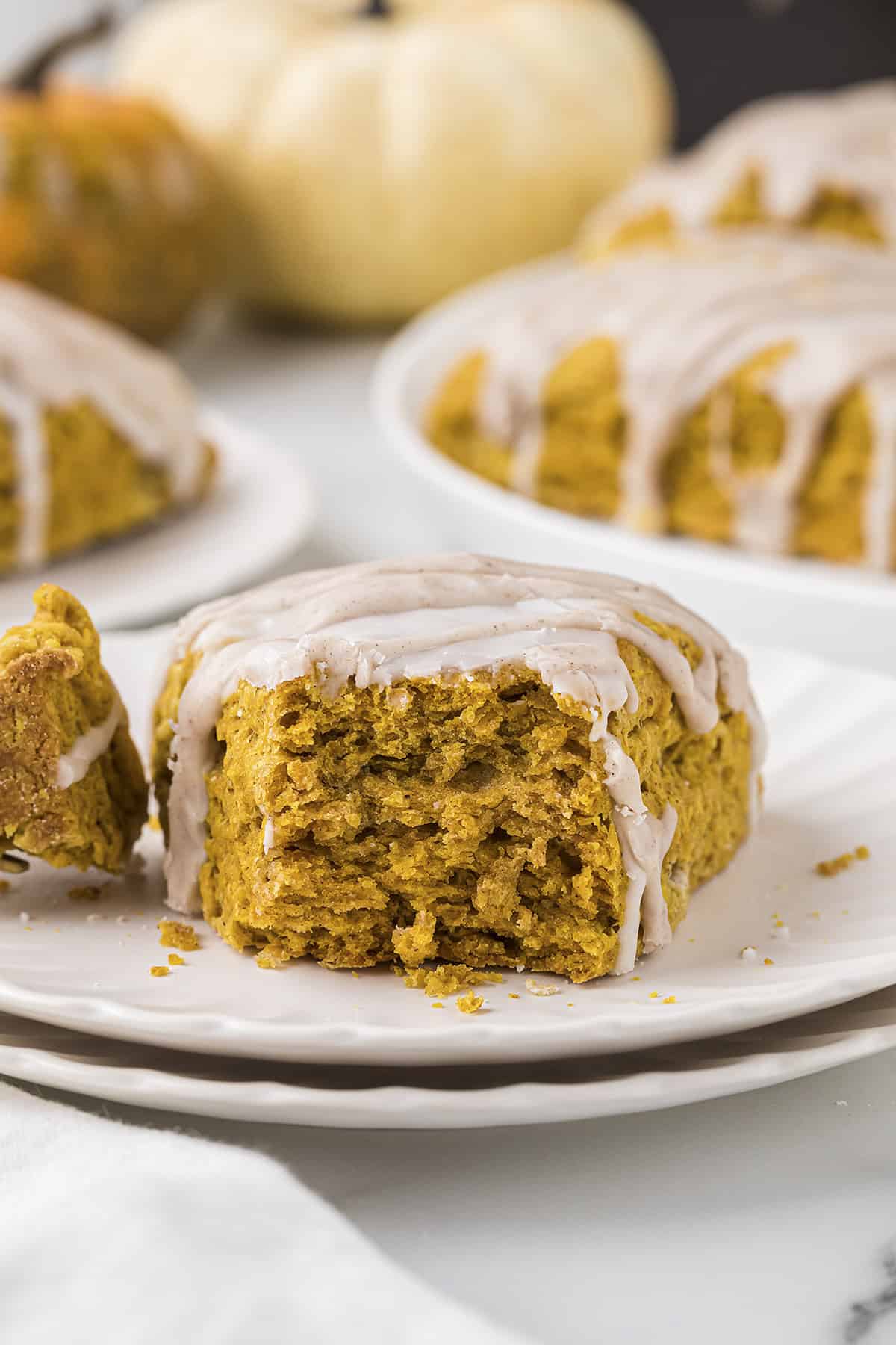 Tender, flaky pumpkin scone on plate.