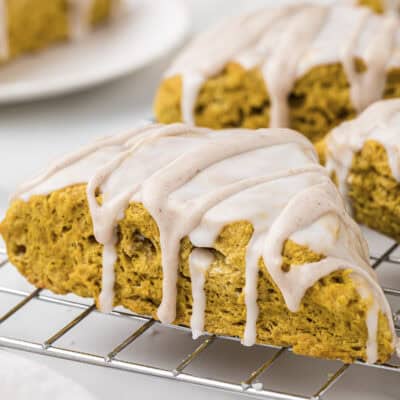 Glazed pumpkin scone on cooling rack.