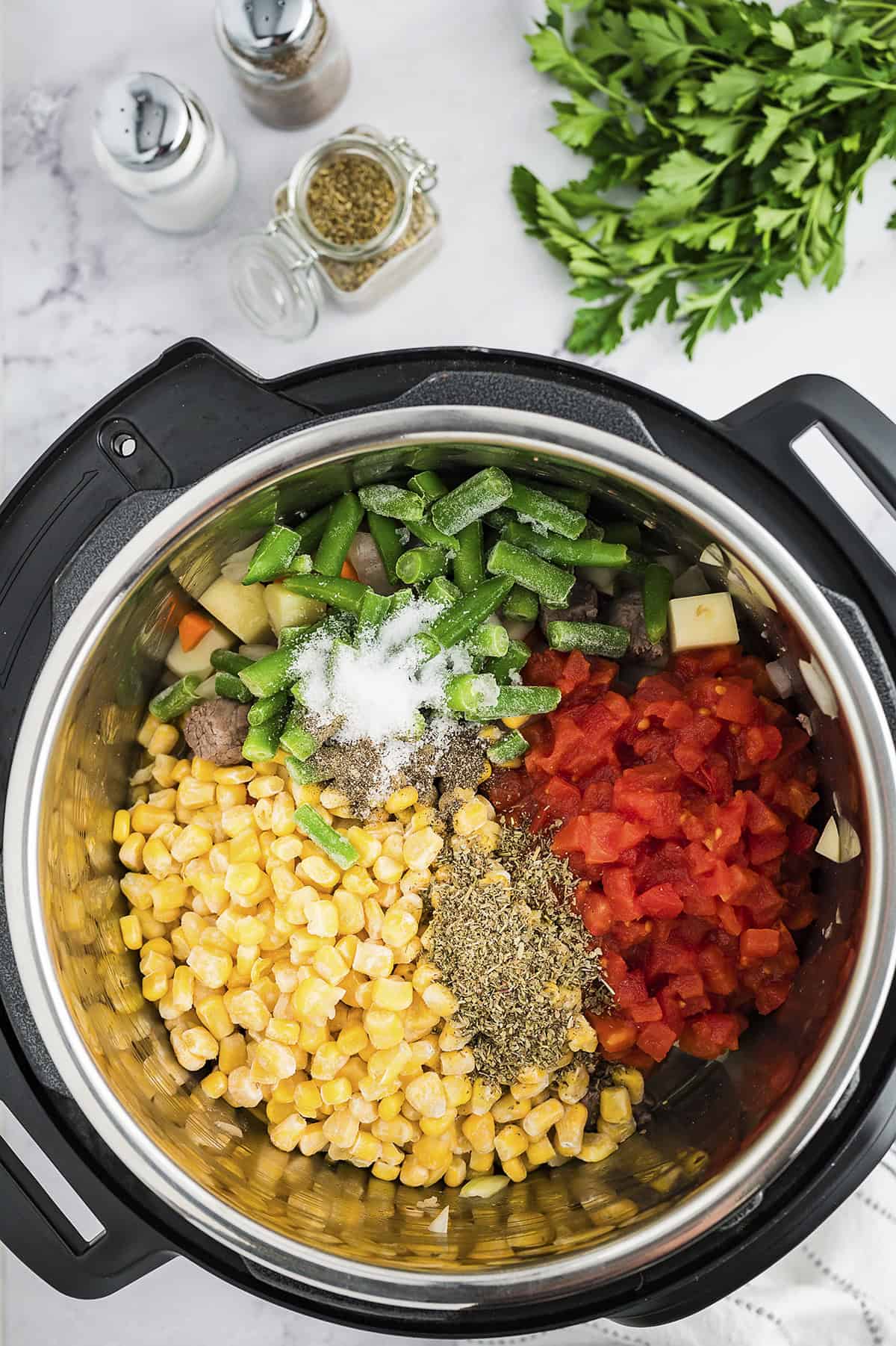 Vegetables and seasoning in Instant Pot.