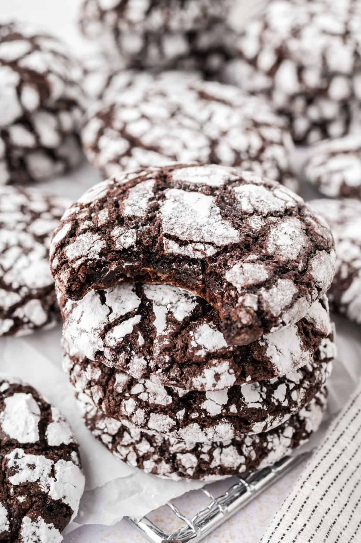 Chocolate crinkle cookies on cooling rack.