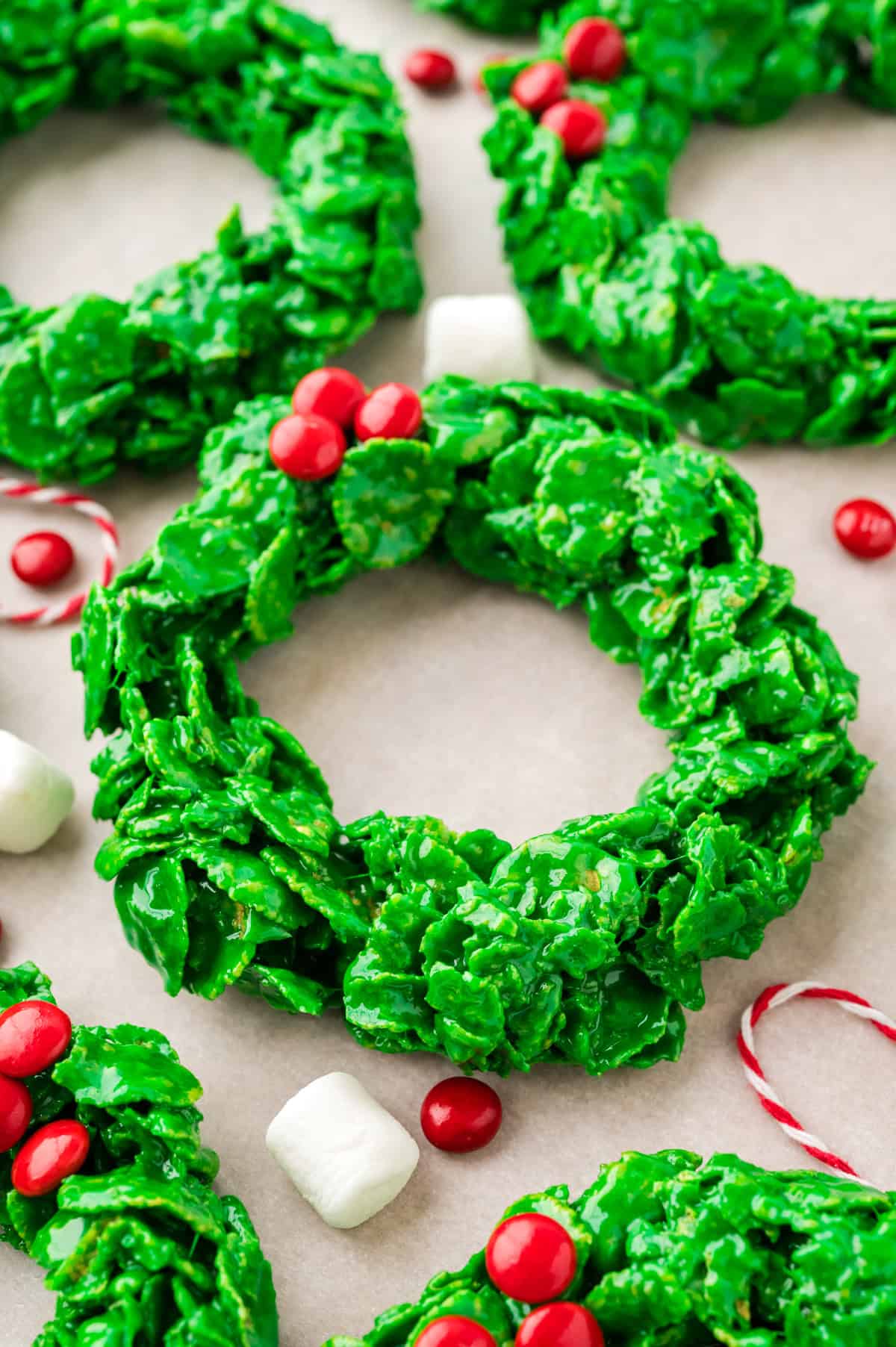 Christmas wreath cookies on parchment.