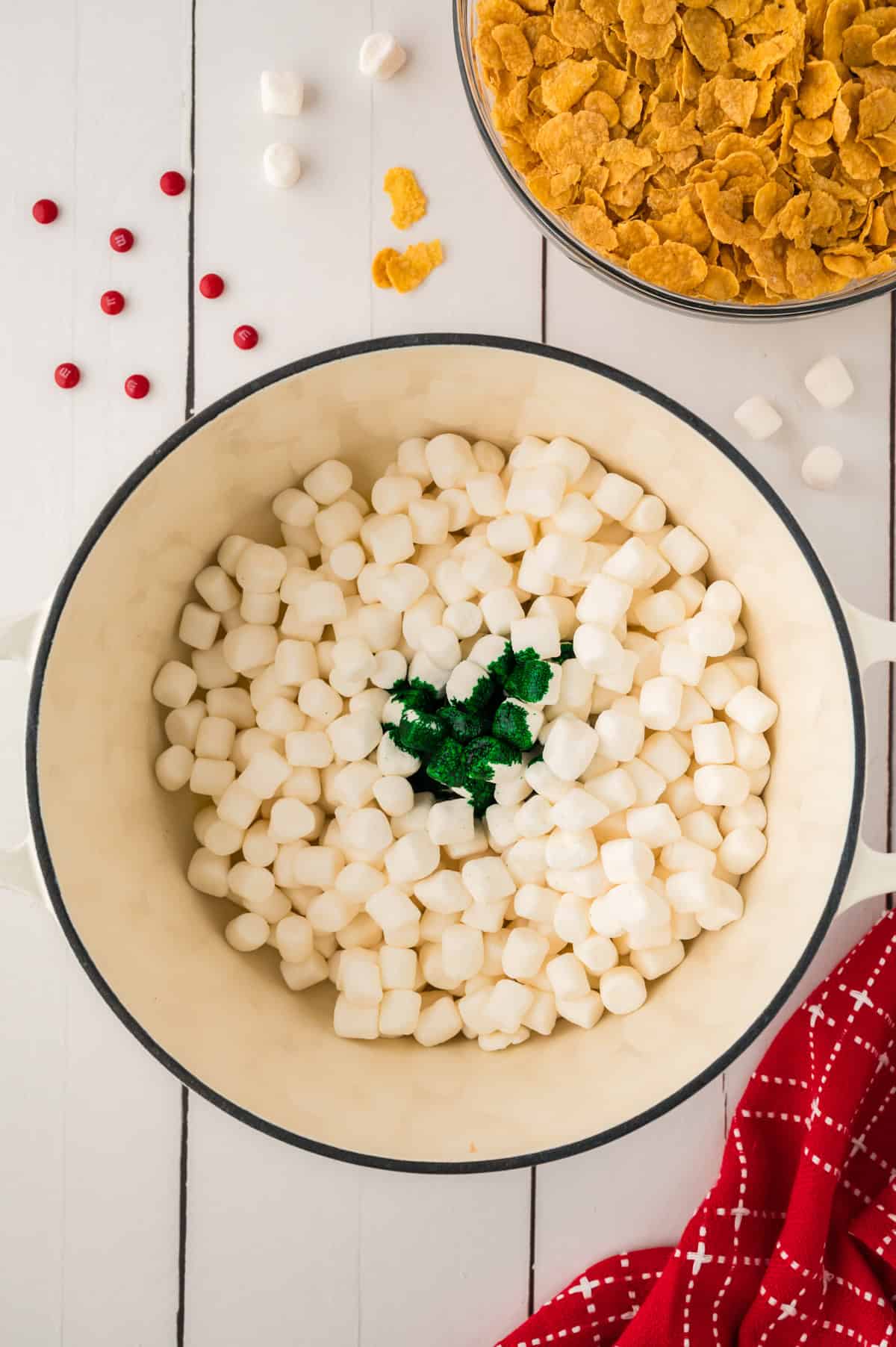 Marshmallows, butter, and food coloring in pot.