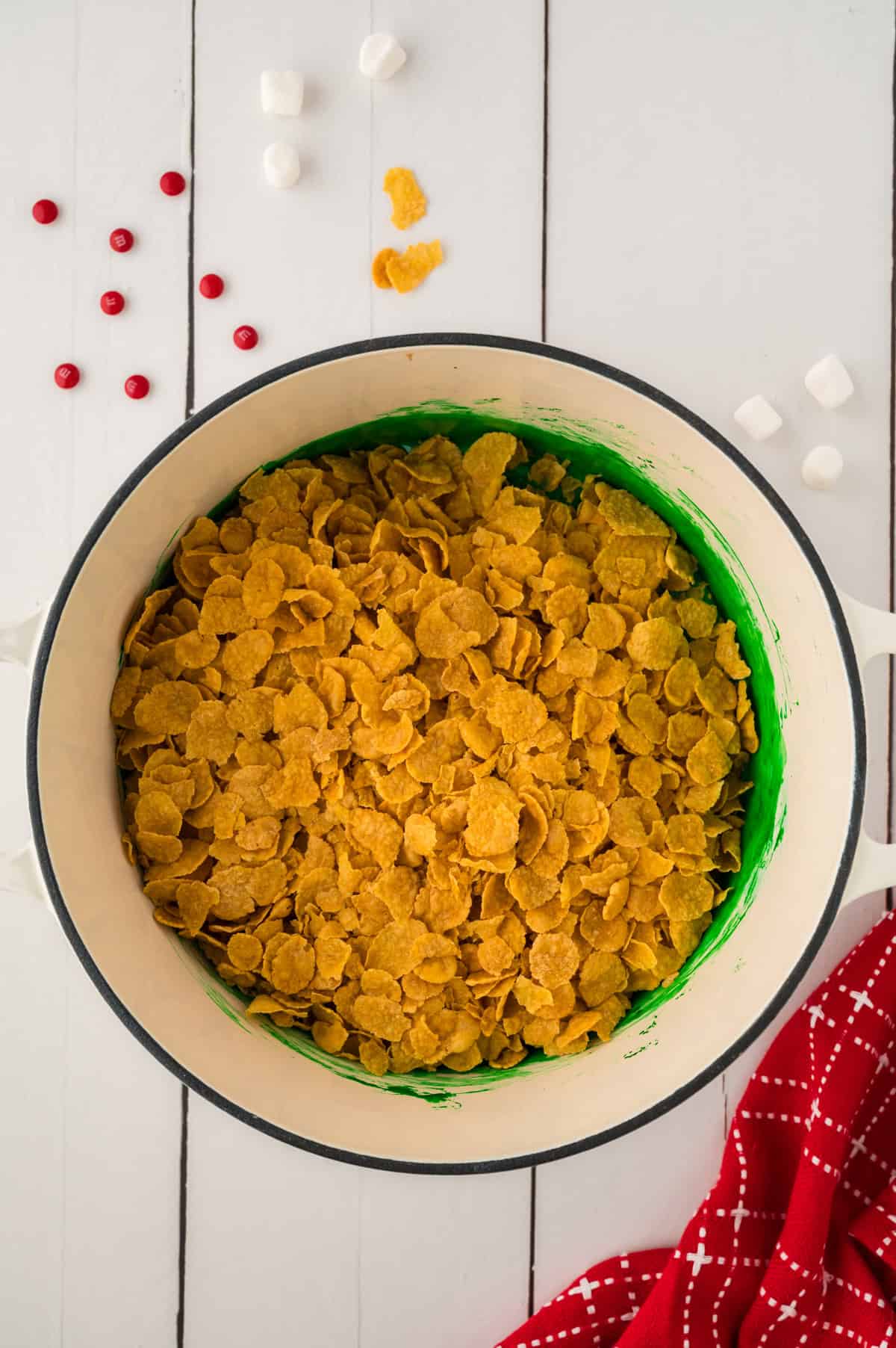 Cornflakes in pot with marshmallow mixture.