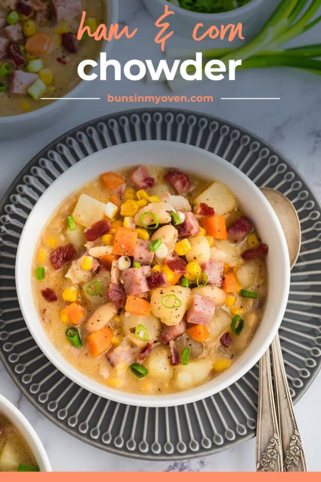 Corn chowder with ham in white bowl.