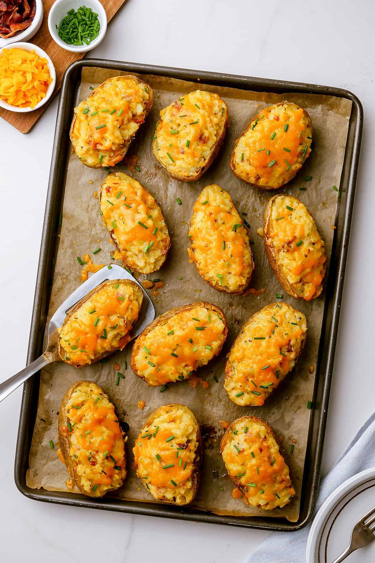 twice baked potatoes on baking sheet.