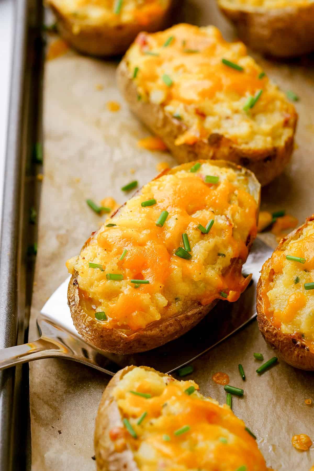 baked potatoes on baking sheet.