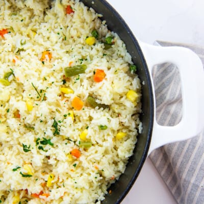 white rice with mixed vegetables in skillet.