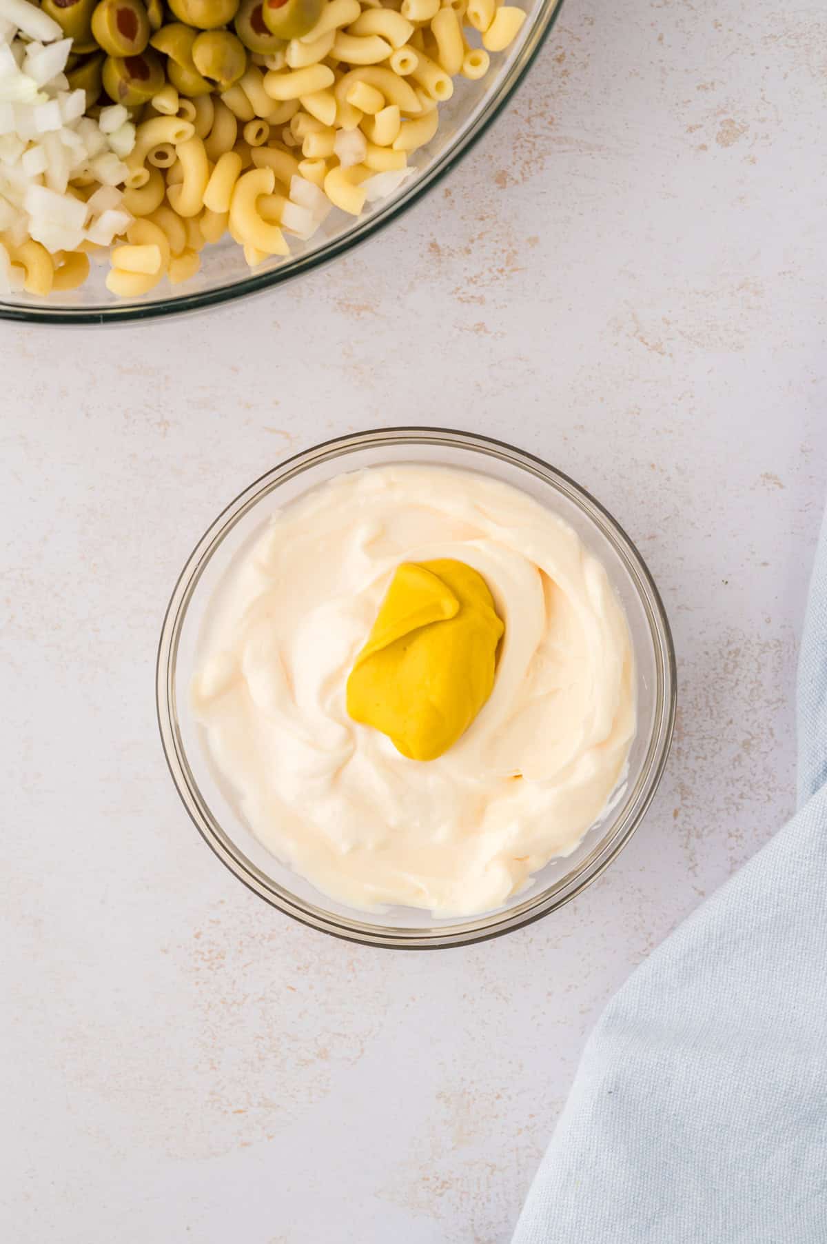 Dressing for pasta salad in small bowl.