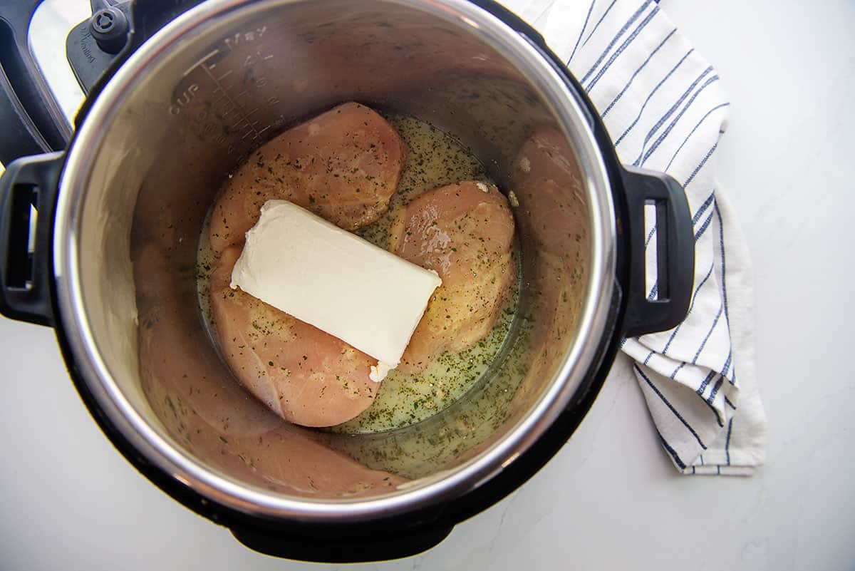 chicken and cream cheese in Instant Pot.