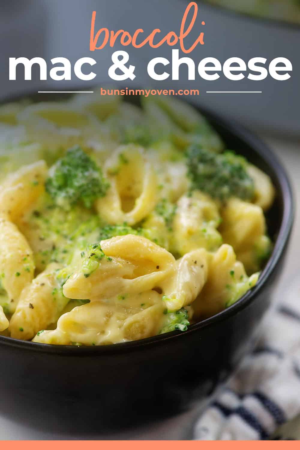 broccoli mac and cheese in black bowl with text for pinterest.