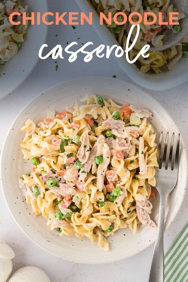 Chicken noodle casserole on plate with fork.