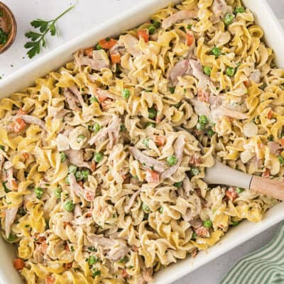 Chicken noodle casserole in white baking dish.