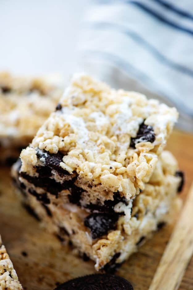 stack or Oreo rice crispy treats on wooden board