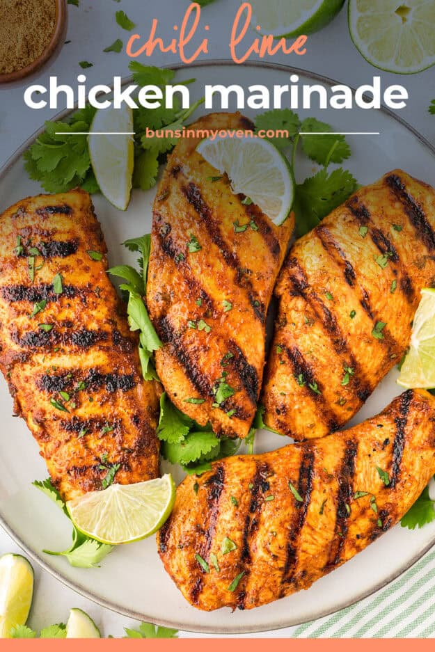 Grilled chicken breasts on platter.