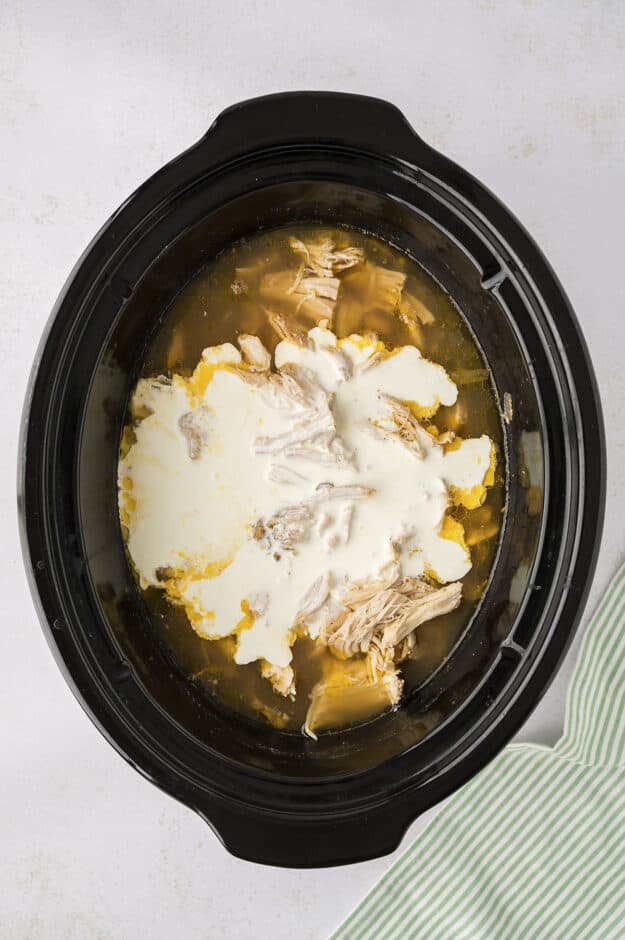 Crockpot white chicken chili with cream added to the broth to thicken it up.