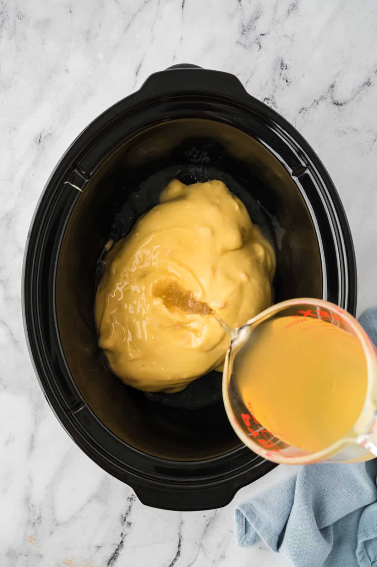 Ingredients for creamy chicken noodles in crockpot.