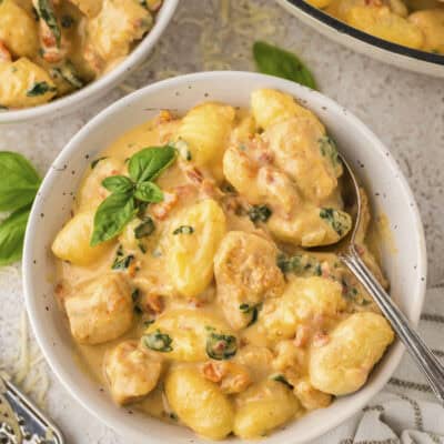 Bowl full of Tuscan chicken and gnocchi.