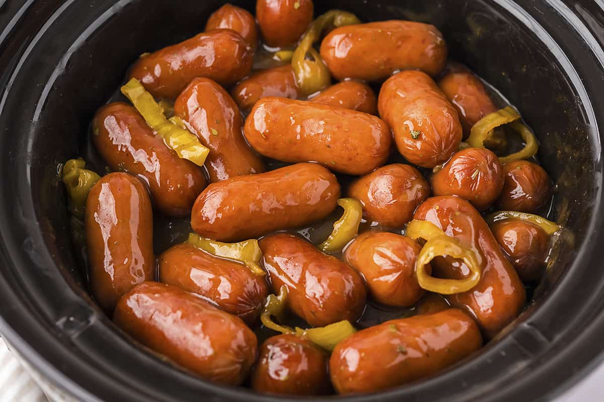 Lil smokies in gravy in a crockpot.