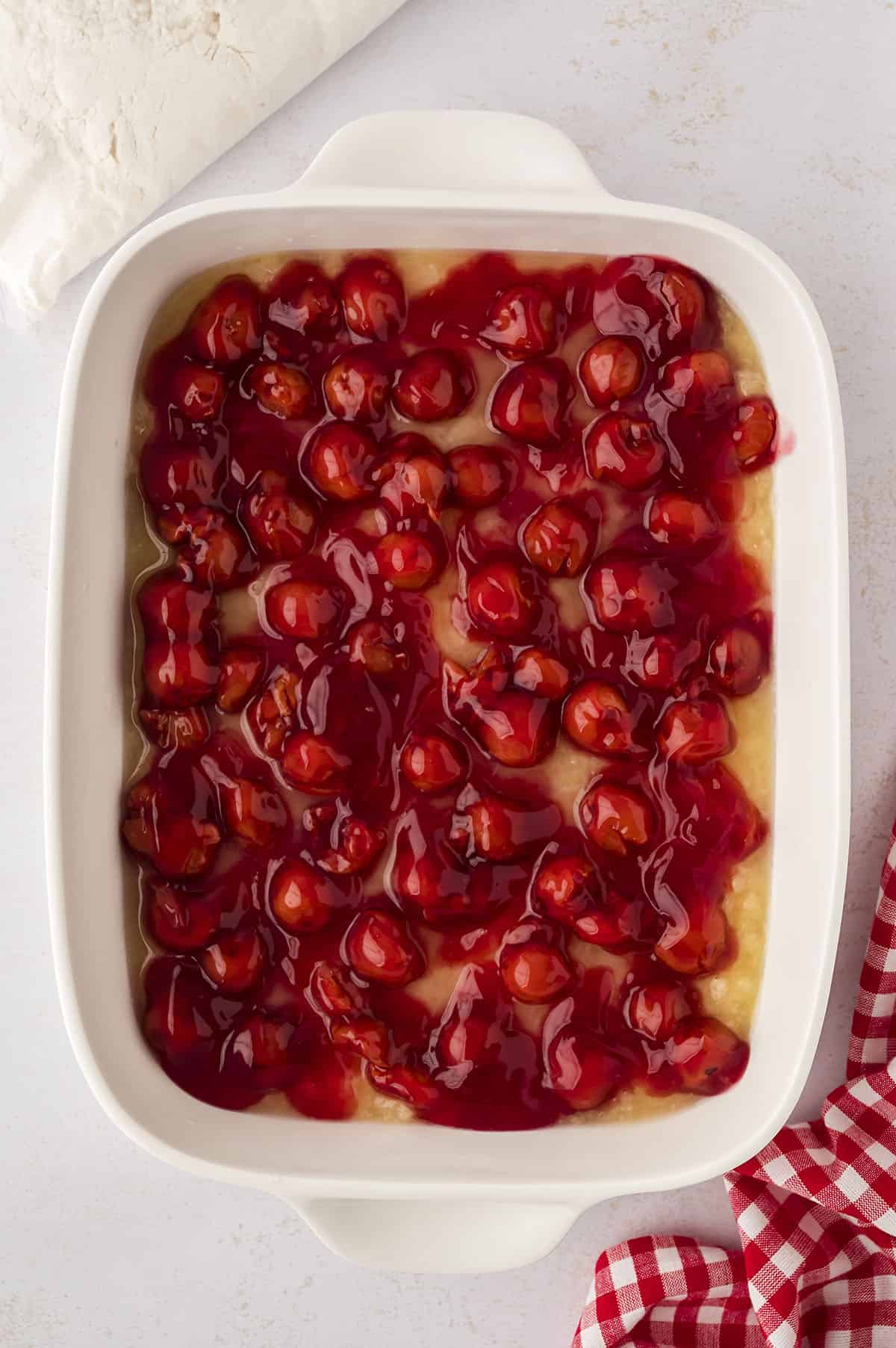 Cherry pie filling in bottom of 9x13 baking dish.