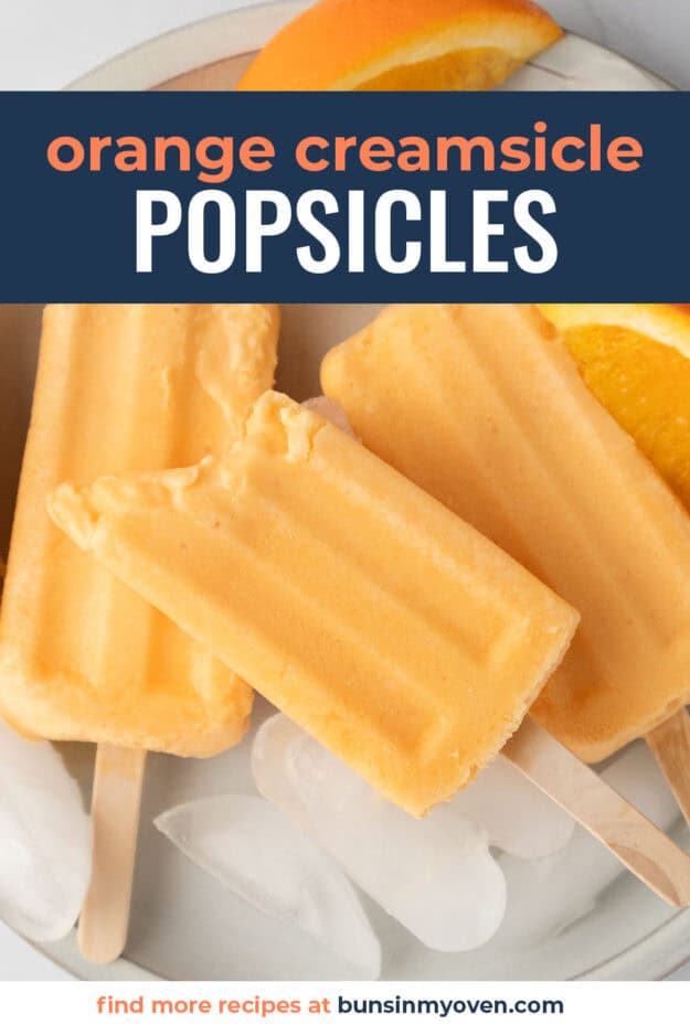 Orange cream popsicle with a bite taken out of it.