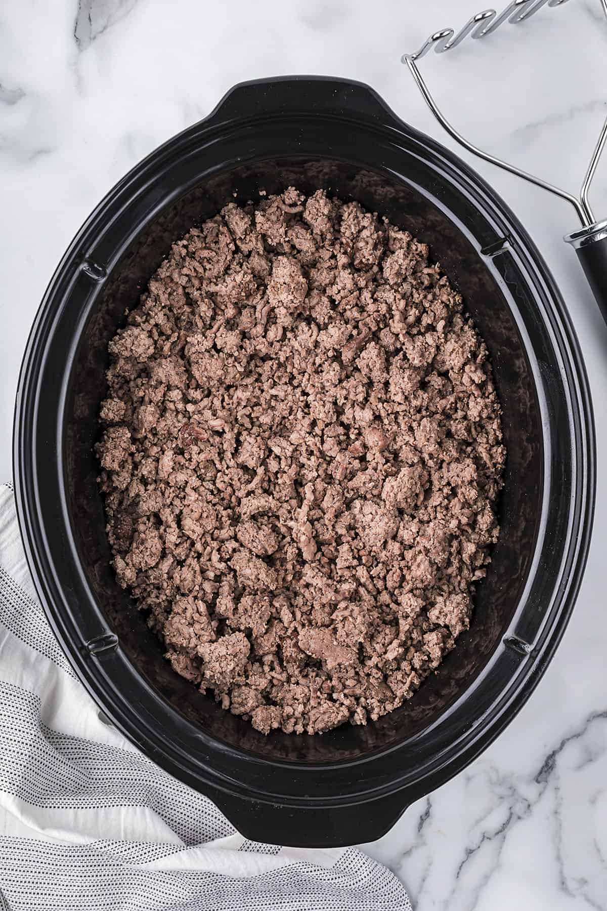 Cooked ground beef in crock pot.