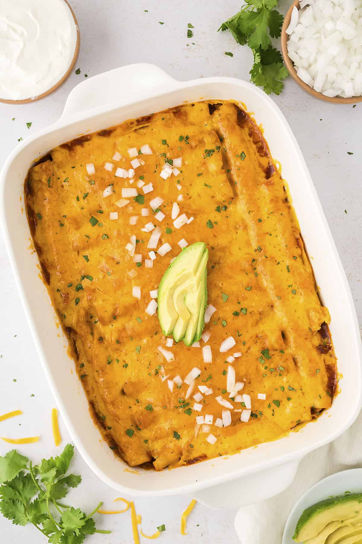 Baked lazy enchiladas in white baking dish.