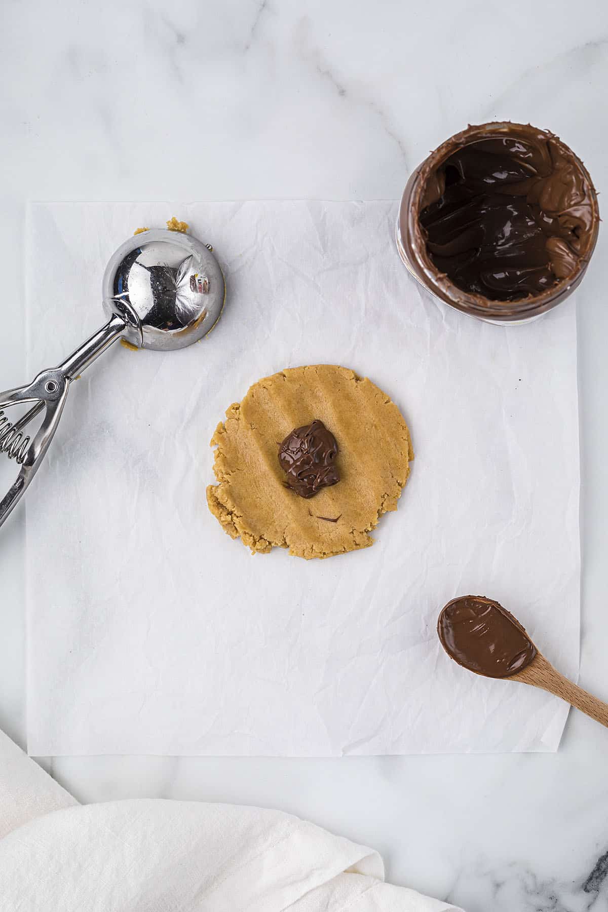 Spoonful of Nutella in a piece of cookie dough.