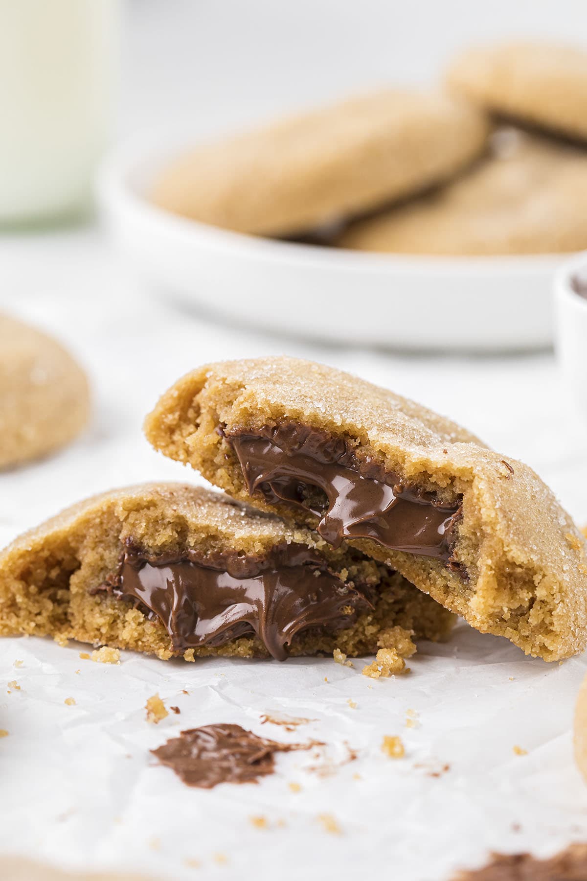 Nutella stuffed cookies broken open and stacked together.