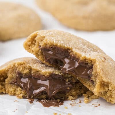 Nutella stuffed peanut butter cookies on sheet pan.