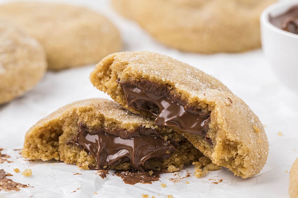 Nutella stuffed peanut butter cookies on sheet pan.