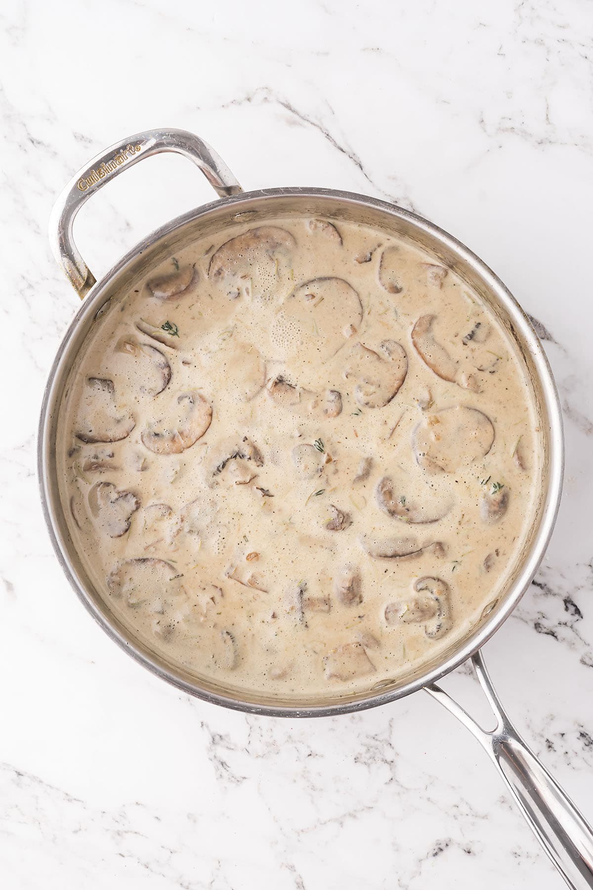 Mushroom cream sauce in skillet.