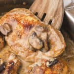 Cream of mushroom chicken in skillet.