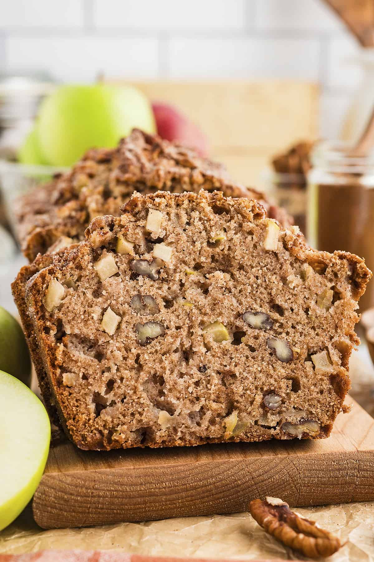 Slices of apple bread on cutting board.