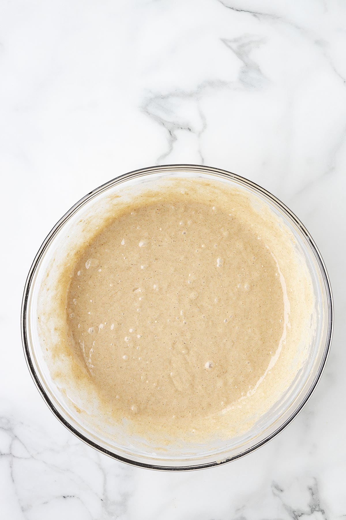 Cake batter in glass bowl.